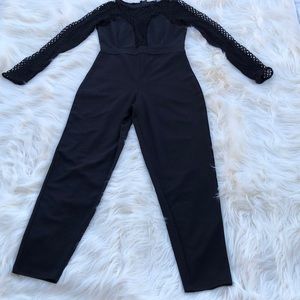NEW!! JUMPSUIT WITH FISHNET SLEEVES. Never worn!!